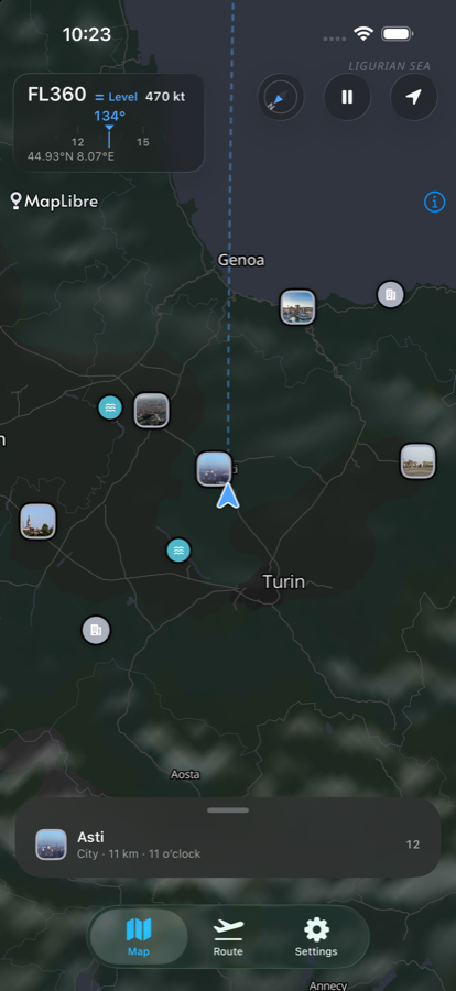 The Groundtrack map at FL360 over northern Italy. A dashed
                        groundtrack runs up the screen past the aircraft symbol,
                        Turin and Genoa are labelled, photograph badges mark places
                        on the ground, and a card at the foot reads ‘Asti · City ·
                        11 km · 11 o’clock’.